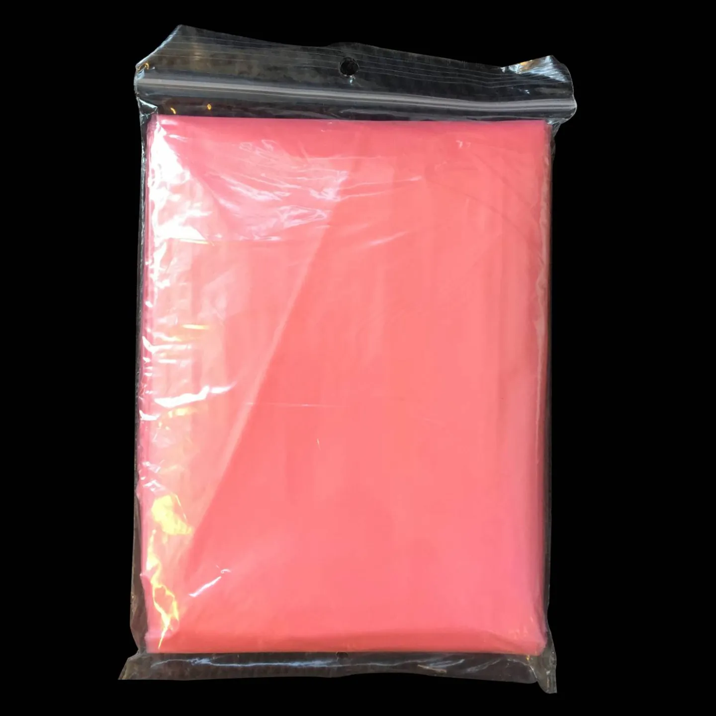 roze wegwerp poncho verpakt.